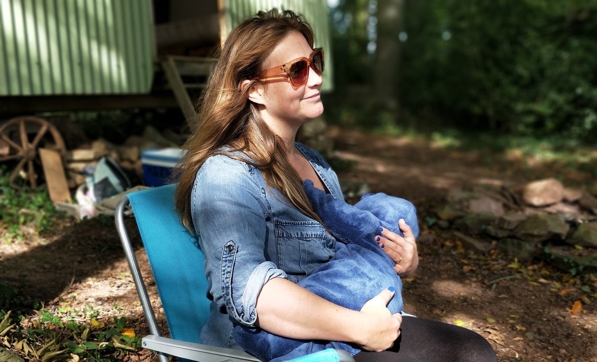 Woman breastfeeding outdoors