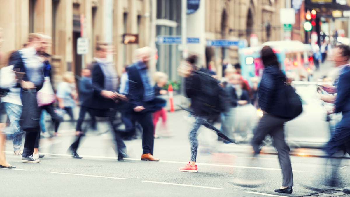 Blurred image of people walking in the CBD